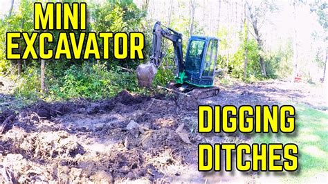 how to dig a ditch with a mini excavator|digging a ditch with a mini.